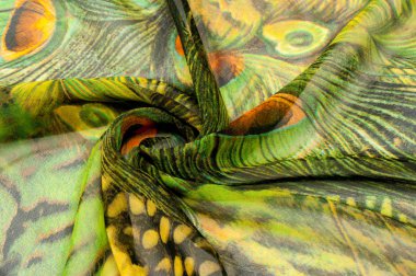 Arka plan doku, çizim. İpek kumaş. Işık havadar kumaş. Yeşil tavus kuşu tüyü ile. Sarı gölge. Kumaş Pamuk ipek batiste nane yeşili havadar çok hafif şeffaflık