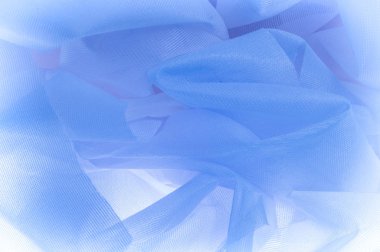 Doku, arka plan, ipek kumaş dokusuna mavidir. İpek kumaş saydamdır. Kumaş ya da sıvı illüstrasyon ipek saten doku veya kadife malzeme dalgalı kırışıklıklar dalga veya lüks mavi