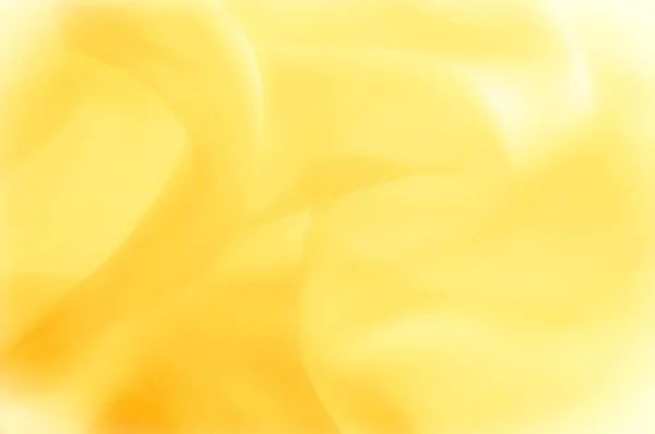 Das Foto ist unscharf. Textur, Hintergrund, Muster. gelbe Seide — Stockfoto