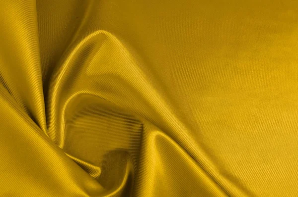 Tekstur, latar belakang, pola. Satin kuning adalah kain sutra . — Stok Foto