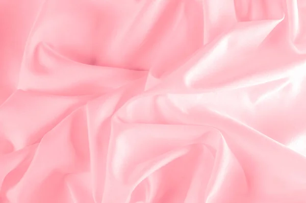 背景のテクスチャです。シルク生地のピンク。ピンクのシルクを織り込んだこの粉末 — ストック写真