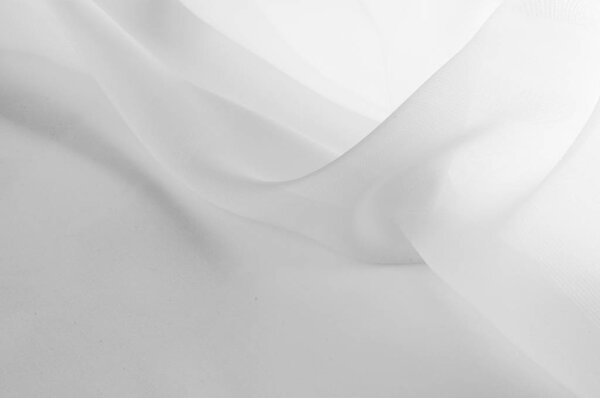 Texture, background, pattern. Silk fabric is transparent, white 