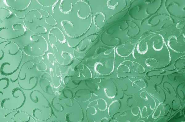 Background texture, pattern. green tulle. Add an antique touch t