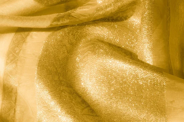 Textura, fundo, padrão. Tecido - luz de seda. O ouro é amarelo — Fotografia de Stock