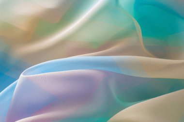 Doku, arka plan, desen. İpek kumaş şeffaf, sarı-pembe yeşil mavi olduğunu. Soyut yumuşak şifon doku arka plan. 