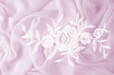 Doku, arka plan, desen. Dantelli beyaz kumaş. Çiçek dantel kumaştan yapılmış. Pembe ipek kumaş. tebrik kartı. Masaüstü duvar kağıdı. Tasarımcı için ekran koruyucu zemin