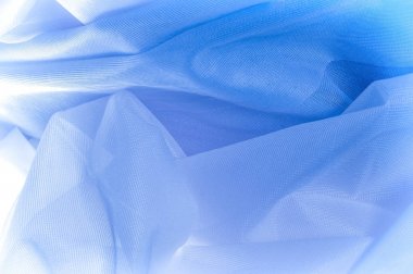 Doku, arka plan, ipek kumaş dokusuna mavidir. İpek kumaş saydamdır. Kumaş ya da sıvı illüstrasyon ipek saten doku veya kadife malzeme dalgalı kırışıklıklar dalga veya lüks mavi