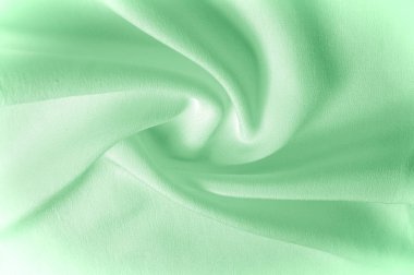 Doku arka plan deseni. Yeşil ipek kumaş. Bir corr closeup