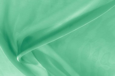 Doku, arka plan, desen. Soluk yeşil ipek kumaş. Bu pek de yumuşak ve ince tül, yumuşak ipek tül var. Görünüşe göre bir perdelik, bir düğün hayal çok yumuşak