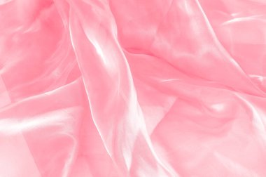 Arka plan doku, desen. Kumaş pembe ipek. Pürüzsüz zarif pembe ipek veya saten düğün arka plan olarak kullanabilirsiniz. Lüks Sevgililer günü arka plan tasarım.