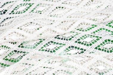 Doku arka plan deseni. Dantelli beyaz kumaş. Beyaz arka plan üzerinde el dantel. Beyaz guipure, nakış kumaş bir gelinlik, kartpostal, fotoğraf duvar kağıtları, afiş için,