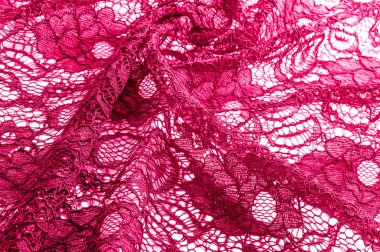 Doku, arka plan, desen. Kumaş kırmızı dantel. Arka planını dantel kumaştan gül stilize. Çiçekli soyut dantel modeli. Duvar kağıdı, iç çamaşırı ve takı. Davetler