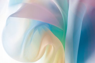 Doku, arka plan, desen. İpek kumaş şeffaf, sarı-pembe yeşil mavi olduğunu. Soyut yumuşak şifon doku arka plan. 