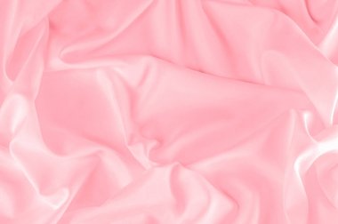 arka plan doku. ipek kumaş pembe. Bu toz pembe ipek dokuma bahar romantik bir hava verir. Onun nazik sesi yapım o pürüzsüz ve parlak saten gibi yüz sunar. 