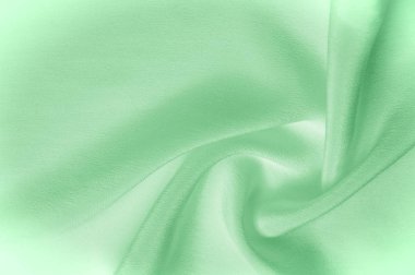 Doku arka plan deseni. Yeşil ipek kumaş. Bir corr closeup