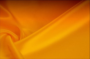 Doku, arka plan, desen. Kırmızı, sarı altın tonları ipek kumaş, metin alanı. Doğal doku üzerinde dayalı altın saten doku, kırmızı ipek arka plan