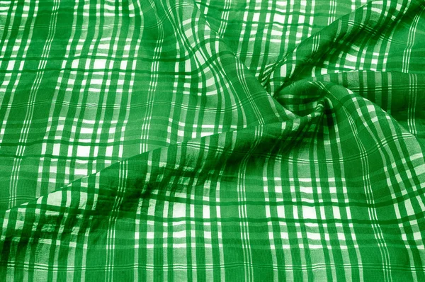 background texture. silk fabric checkered green white. beautiful silk taffeta-twill with wicker check in the \