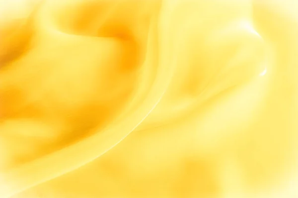 Η φωτογραφία είναι θολή. Υφή, φόντο, φαντασία. Κίτρινο μετάξι — Φωτογραφία Αρχείου