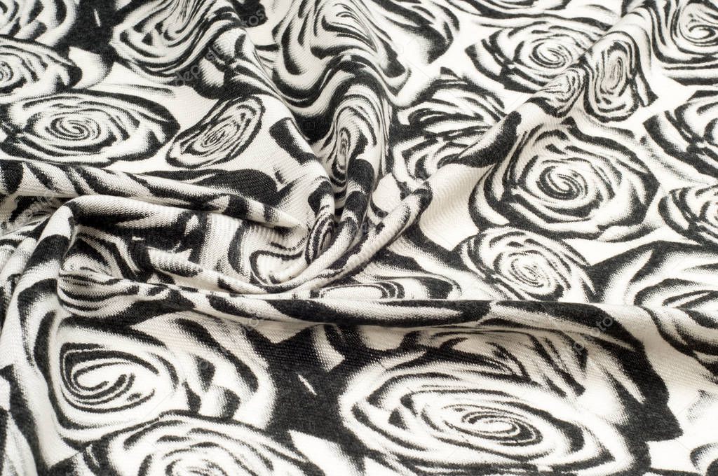 Texture, background, pattern. A woolen scarf, black and white, roses are drawn on a scarf. Woolen black and white fabric.100% pure virgin wool & authenticity labels black white houndstooth 
