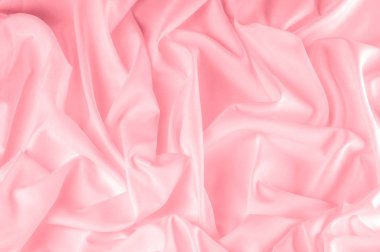 arka plan doku. ipek kumaş pembe. Bu toz pembe ipek dokuma bahar romantik bir hava verir. Onun nazik sesi yapım o pürüzsüz ve parlak saten gibi yüz sunar. 