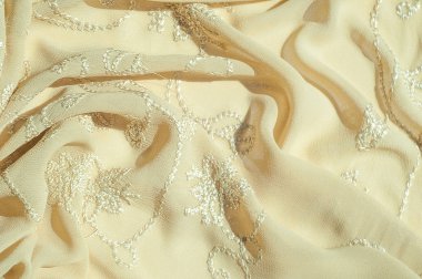 Doku, arka plan, desen. Kadın renk şal. Altın Başak. Limon kremalı. Navajo beyazdır. Eski altın. ipek kumaş.