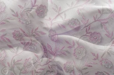 Doku, arka plan, desen. Pembe dantel beyaz arka plan üzerinde. Parlak pembe beyaz dantel ile. Çiçekler Lacy desenle. Doku pembe dantel arka plan, duvar kağıdı için kapalı