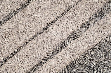 Doku, kumaş, arka plan. Altın iplik iplik ile bir daire desenli dantel kumaş