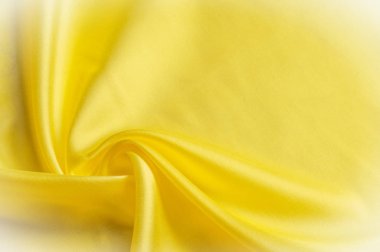 Doku arka plan deseni. İpek kumaş, sarı kumaş. Siyah bir arka plan üzerinde. Çiçek Tekstil veya kumaş. Kumaş dokusuna. Kumaş, tekstil, kumaş, dokuma malzeme,.