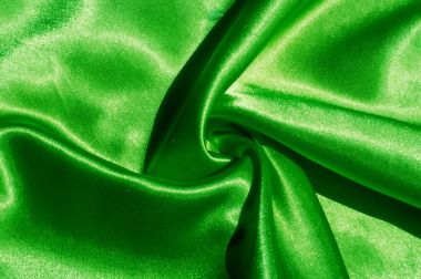 Doku, kumaş, arka plan. Lüks kumaş ya da sıvı dalgalar ya da dalgalı kırışık ipek saten doku kadife malzeme ya da lüks Noel ya da zarif arka plan arka plan. Yeşil