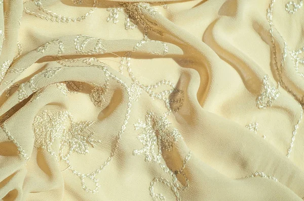 Doku, arka plan, desen. Kadın renk şal. Altın Başak. Limon kremalı. Navajo beyazdır. Eski altın. ipek kumaş.