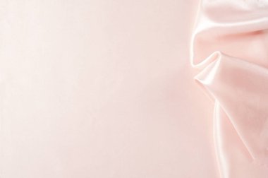 Doku, arka plan, desen. Kumaş ipek pembe arka plan. Güzel pembe saten. Perdelik arka plan. rüzgarlar dalgalar, kıvrımları güzel bir arka plan oluşturma.