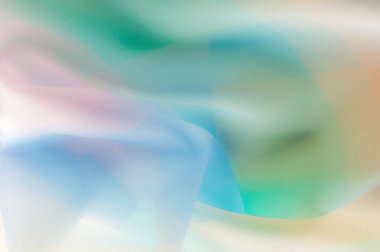 Bulanık, değil keskin netlik doku, arka plan, desen. İpek kumaş şeffaf, sarı-pembe yeşil mavi olduğunu. Soyut yumuşak şifon doku arka plan. 