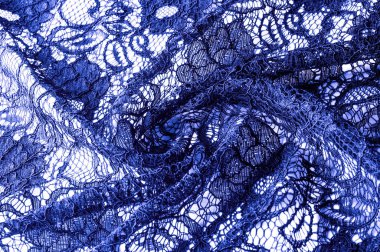 Doku, arka plan, desen. Mavi dantel kumaştan. Arka planını dantel kumaştan gül stilize. Çiçekli soyut dantel modeli. Duvar kağıdı, iç çamaşırı ve takı. Davetler