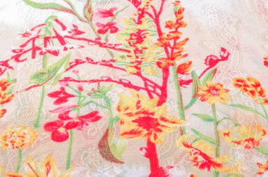 Doku, arka plan, desen. İpek elbise. Beyaz bir arka plan üzerinde parlak kırmızı yeşil çiçekler. Soyut desen