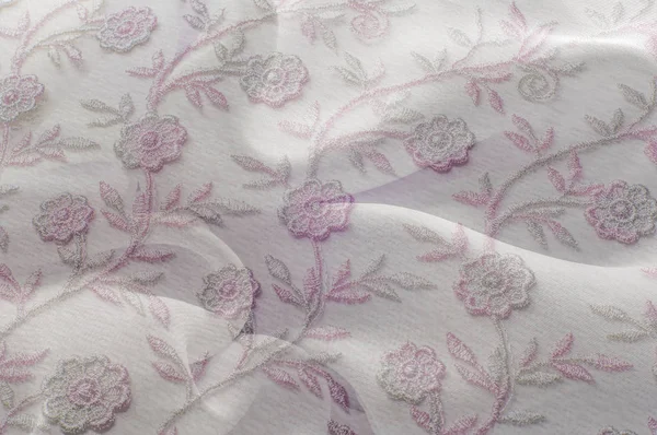 Doku, arka plan, desen. Pembe dantel beyaz arka plan üzerinde. Parlak pembe beyaz dantel ile. Çiçekler Lacy desenle. Doku pembe dantel arka plan, duvar kağıdı için kapalı