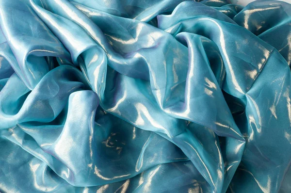 Doku, arka plan, desen. İpek kumaş mavi, ince havadar ipek kumaş, kumaş güneş ışınlarının yansıtır.