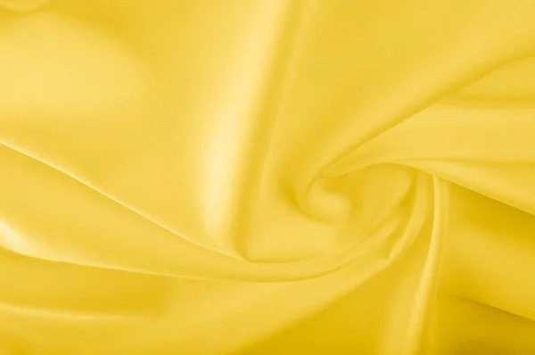 texture. silk fabric - yellow. This shiny material has a really