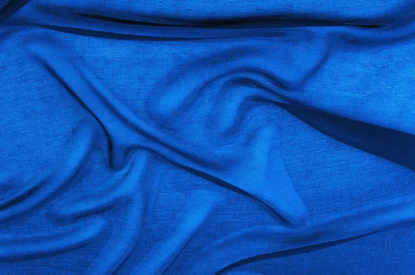 Текстура, фон, візерунок. Синя прозора тканина. Кришталевий о — стокове фото