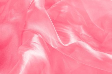Arka plan doku, desen. Kumaş pembe ipek. Pürüzsüz zarif PIN