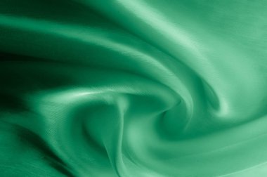 Doku, arka plan, desen. Soluk yeşil ipek kumaş. Çok