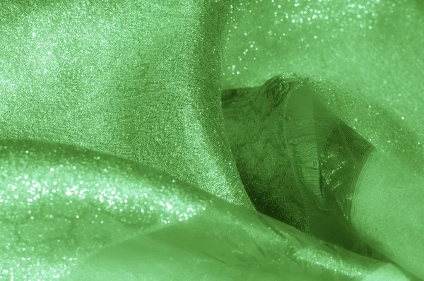 Doku, arka plan, desen. Kumaş - ipek ışık. Soluk yeşil kumaş. Güzel resim. Vintage soluk kumaş, astar için uygun. Polyester. Çok uçuk yeşil veya doğru renk tuşları ile kekler için.