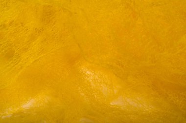 Doku arka planı, desen. Örgü sarı kumaş. Accen için ideal