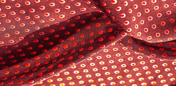 Texture background, pattern, red silk fabric with red polka dots