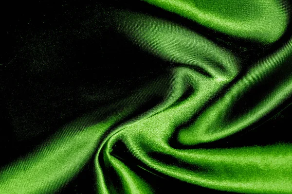 texture, background, pattern. green silk fabric panoramic photo.