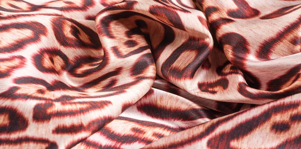 Texture, background, pattern. silk fabric, tiger skin, light and — Stock Photo, Image