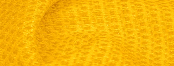 Textura de fundo, padrão. Tecido amarelo com lantejoulas metálicas — Fotografia de Stock
