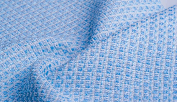 Texture, fabric, pattern. Large weave of blue and white threads,