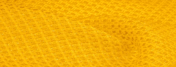 Textura de fundo, padrão. Tecido amarelo com lantejoulas metálicas — Fotografia de Stock