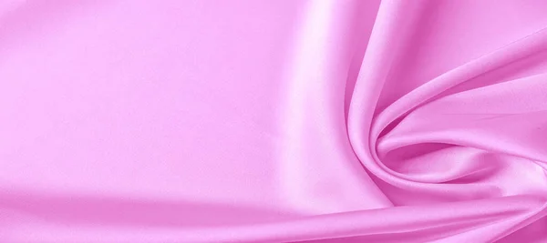 Textura. Tecido de seda rosa. brilho brilhante e característica — Fotografia de Stock