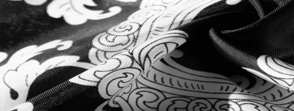 Tekstur, latar belakang, kain sutra hitam dengan pola monogram E — Stok Foto